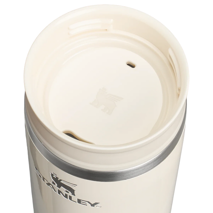Stanley 1913 México cream travel mug with a two-part leak-proof lid and double-wall vacuum insulation.