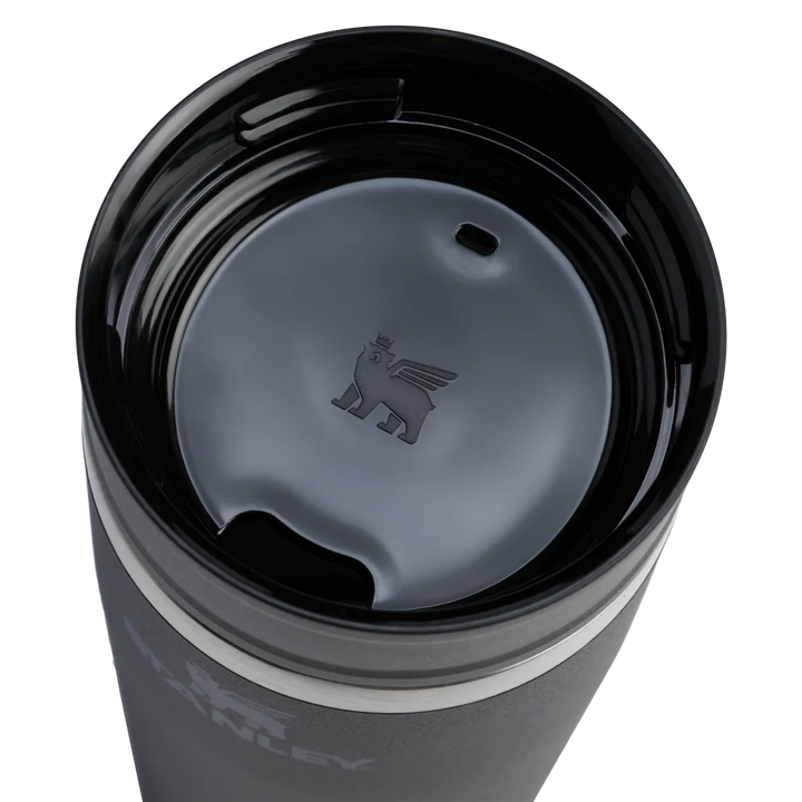 Stanley 1913 México dark grey stainless steel 473ml travel mug with two-part leak-proof lid and embossed winged bear logo.