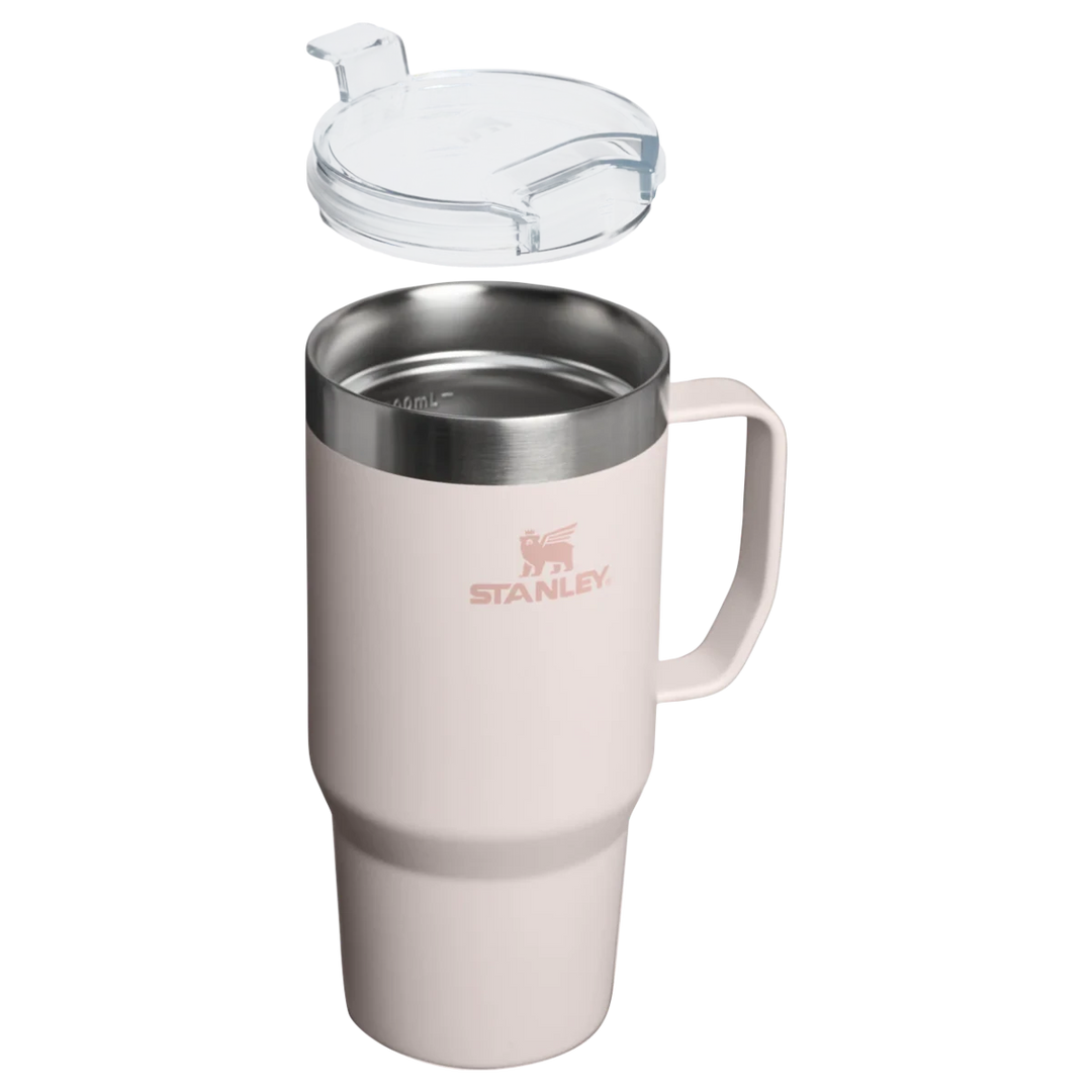 Stanley 1913 México light pink 709ML stainless steel travel mug with handle and clear Tritan lid.