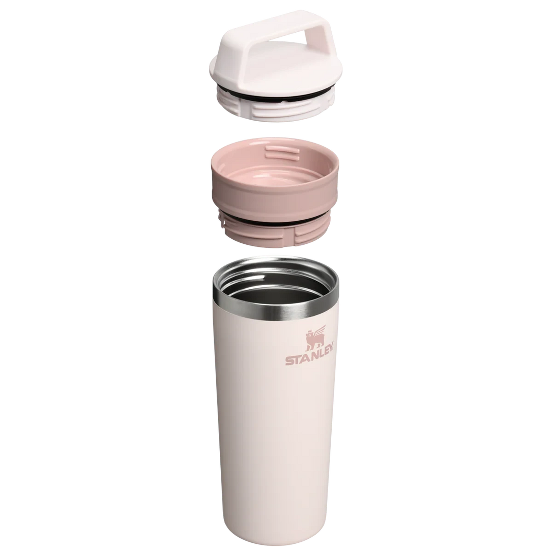 Stanley 1913 México light pink 473ml stainless steel travel mug with two-piece leak-proof lid and handle.