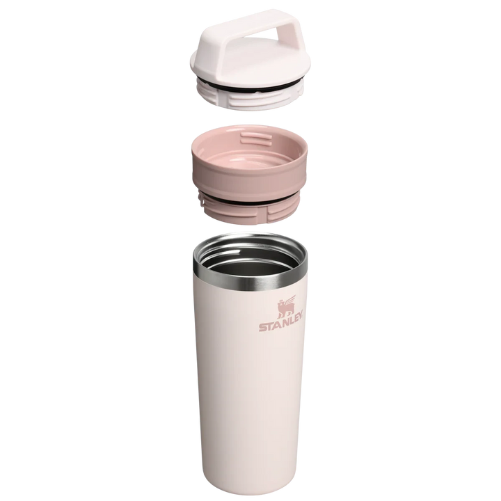 Stanley 1913 México light pink 473ml stainless steel travel mug with two-piece leak-proof lid and handle.